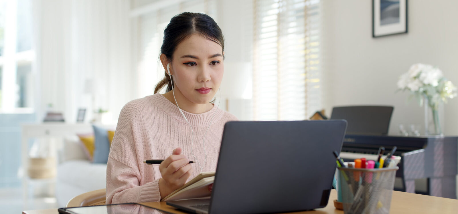 Woman working with laptop indoors
